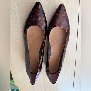 Vionic Women's Lena Pointed Toe Flats in a tortoiseshell patent leather design.